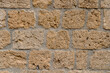 Wall made with many tuff bricks. Wall of tuff stone.