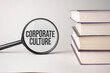 The inscription corporate culture is written and the books. Content lettering is essential for business content and marketing.