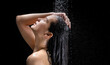 Asian woman She takes a shower and washes her hair. in the black backgroundAsian woman She takes a shower and washes her hair. in the black background