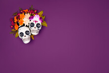 Day Of The Dead, Dia De Los Muertos, Halloween Celebration Background. Sugar Skull, Calaverita, Marigolds Flowers, Purple Copy Space. Traditional Mexican Culture Festival Flyer. Flat Lay, Top View.