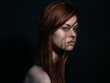 © SHOTPRIME STUDIO - pretty red-haired woman naked shoulders posing close-up dark background