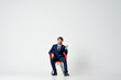 © SHOTPRIME STUDIO - business man in suit sitting on red chair emotions office fun
