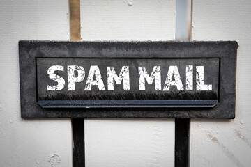 Wall Mural - Spam Mail concept. Metal mailbox in a white wooden fence