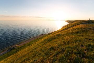 Wall Mural - Beautiful summer sunset on the coastline of Kaseberga in southern Sweden. Nature background.