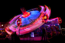 Long Exposure Picture Of A Fairground Ride At Night