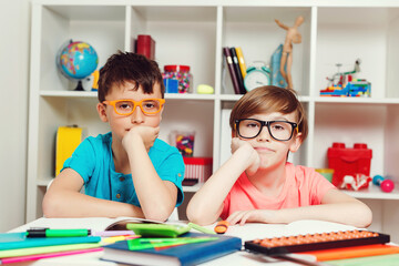 Wall Mural - Cute pupils in classroom at the elementary school. Back to school concept.