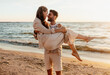 © Syda Productions - leisure and people concept - happy couple having fun on summer beach