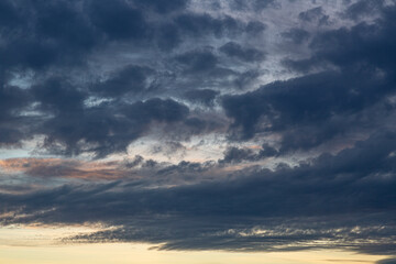 Wall Mural - Image of colorful evening sky with light clouds