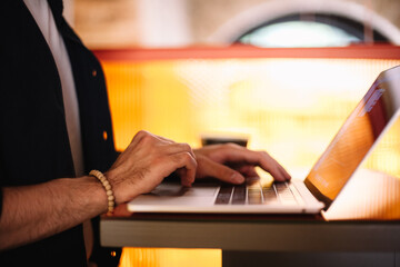 Man using laptop computer at cafe