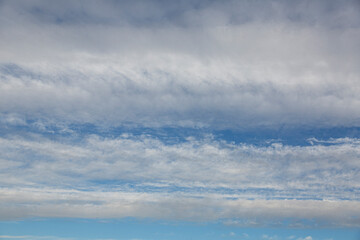 Wall Mural - Image of colorful evening sky with light clouds