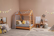 Stylish child room interior with comfortable floor bed