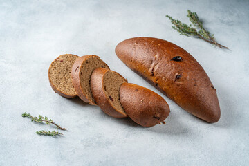 Two loaf of festive sweet raisin bread. Pieces of loaf.