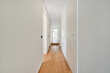 © Cavan - A long empty corridor designed in minimalistic style