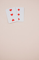 Wall Mural - Vertical shot of cards for a game in a coral background