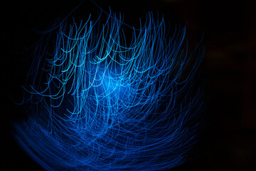 Wall Mural - blue abstract particles and lines with bokeh and blur in dark background.