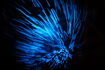 Wall Mural - blue abstract particles and lines with bokeh and blur in dark background.