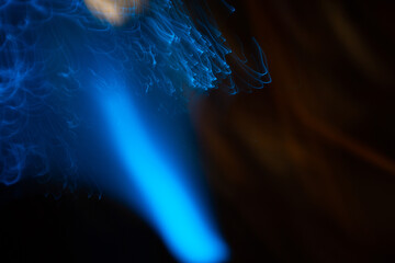 Wall Mural - blue abstract particles and lines with bokeh and blur in dark background.