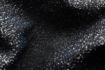 Fabric evening black dress girl with sequins, rhinestones. colorful sequined texture