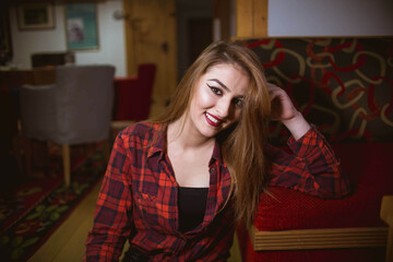 Poster - Young beautiful Caucasian female from Bosnia and Herzegovina posing in a casual outfit at home