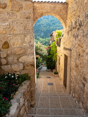 Sticker - small alleyway in provencal village in the French Riviera back country in summer