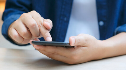 Close up of man hand holding mobile phone , People on smart phone, technology lifestyle