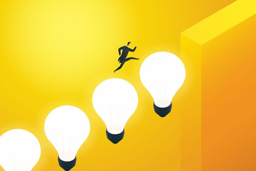 Businessman running on a light bulb up the cliff.