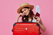 woman with passport and plane ticket red suitcase vacation passenger close-up
