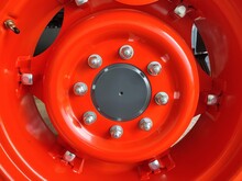 Big Red Tractor Wheel With Eight Bolts And Nuts