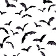 Vector Halloween seamless background with flying bats on white.