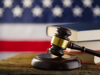 Wall Mural - Judge's gavel, American Constitution, American flag. Focusing on the foreground. Justice, legality, human rights. Advertising business, poster, banner. Color image.