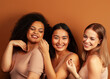 © iordani - young pretty asian, caucasian, afro woman posing cheerful together on brown background, lifestyle diverse nationality people concept