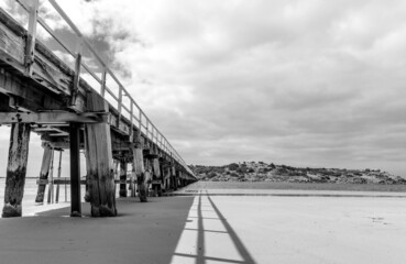  Victor Harbor - Granite Island Causeway during a sunny & overcast day - Black & White. South Australia