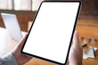 © Farknot Architect - Mockup image of a woman holding digital tablet with blank white desktop screen