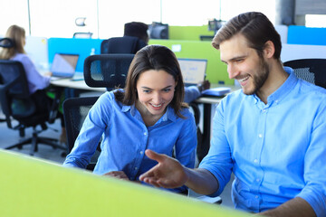 Poster - Two collegues discussing documents and other working moments in office.