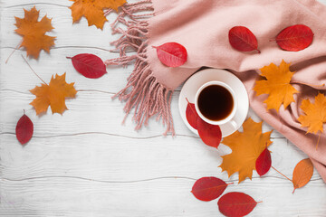 Fotomurales - Autumn composition with leaves cup of coffee and scarf on the white wooden background