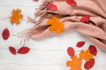 Fotomurales - Autumn flat lay composition with leaves and scarf on the white wooden background