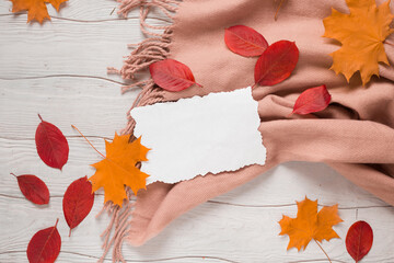 Fotomurales - Autumn flat lay card with leaves and scarf on the white wooden background