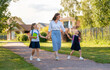 Parent and pupils going to school