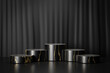 Cosmetic display product stand, Five black gold cylinder podium on black background. 3D rendering illustration