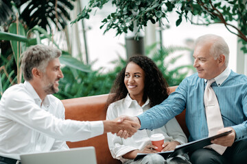 Wall Mural - satisfied business partners shaking hands . business concept.