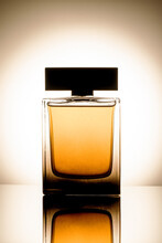 Luxury Perfume Bottle Over Gradient Background. Fragrance Silhouette