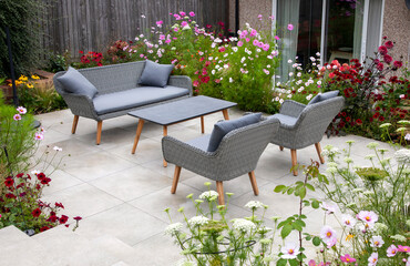 Outdoor living, terrace in the garden with flowers