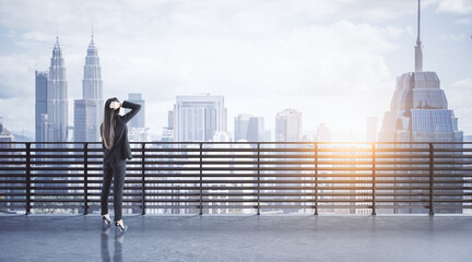 Canvas Print - Thoughtful businesswoman on concrete balcony looking into the distance at city with mock up place. Success and future concept.