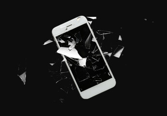 mobile phone with cracked glass screen on dark background