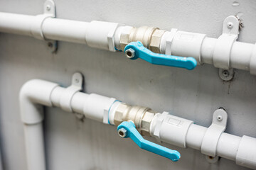 Household water supply system installed in the house. There are sewer pipes and clean water and faucets.