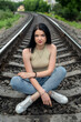 © RomanR - prety lady enjoy summer time on the train track in the nature