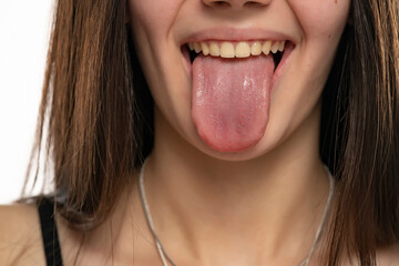 closeup of a young woman with her tongue out