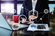 © laddawan - Businesswoman hand using laptop, tablet and smartphone  in office. Digital marketing media mobile app in virtual icon