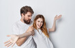 © SHOTPRIME STUDIO - man and woman in white t-shirts are standing next to friendship fun light background