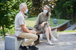 © Yakobchuk Olena - Old couple wearing protective masks expressing gladness and relaxing together
